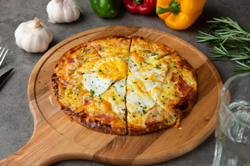 Pizza with egg ham and mushrooms