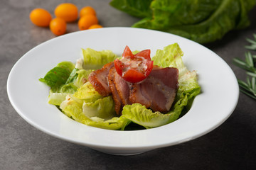smoked duck salad on table