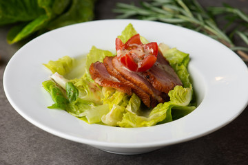smoked duck salad on table