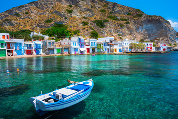 Fototapeta premium Scenic Klima village (traditional Greek village by the sea, the Cycladic-style) with sirmata - traditional fishermen's houses, Milos island, Cyclades, Greece.