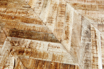 Vintage wooden parquet background. Top view of wooden texture. Herringbone, chevron flooring pattern. 