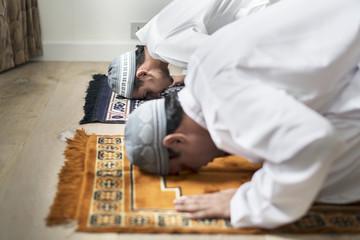 Muslim prayers in Sujud posture - obrazy, fototapety, plakaty