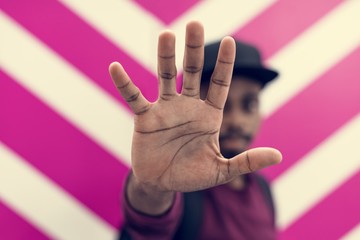 African man doing a "Talk to the hand!" pose