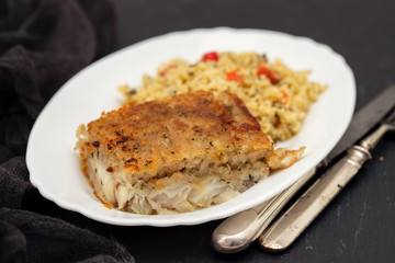 fried fish with garnish on dish