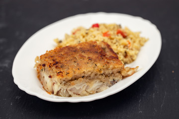 fried fish with garnish on dish