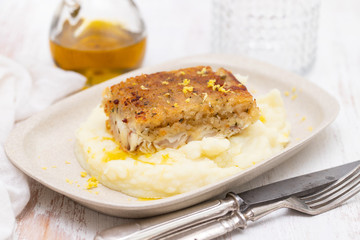 fried fish with garnish on dish