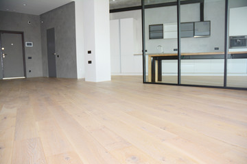 Modern living room zoning with glass wall. Oak wood flooring with modern interior room glass wall.