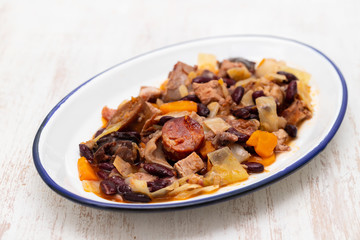 typical portuguese dish feijoada transmontana on white plate