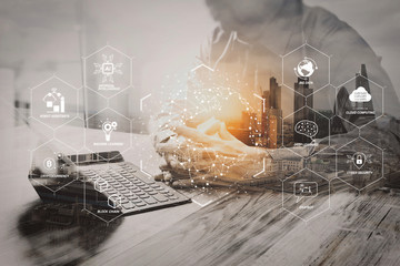 Double Exposure,businessman working with new start up project.using smart phone digital tablet docking smart keyboard on wooden desk,sun effect