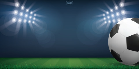 Naklejka premium Soccer football ball on green grass of soccer field or football field stadium background. Vector.