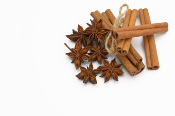 Cinnamon sticks and cardamom on a white background. Aromatic spices.