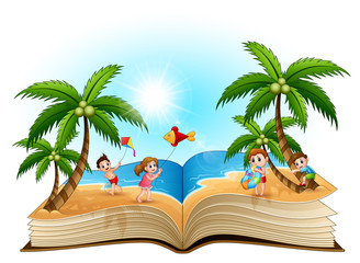 Obraz premium Open book with group of happy children playing on the beach