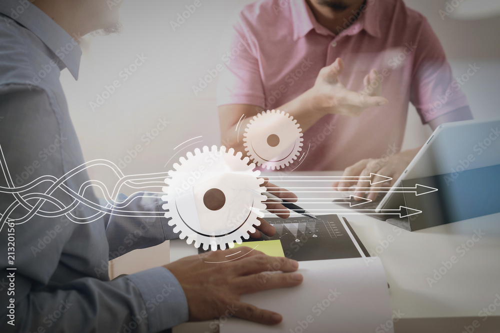 Poster Businessmen working together on a document and using smart phone and digital tablet and laptop computer in modern office