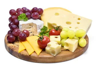 Fotobehang Delicious cheese plate with various sorts of cheese like Emmentaler, gouda and brie. Gourmet cheese on a wooden cutting board, isolated on white background. © eivaisla