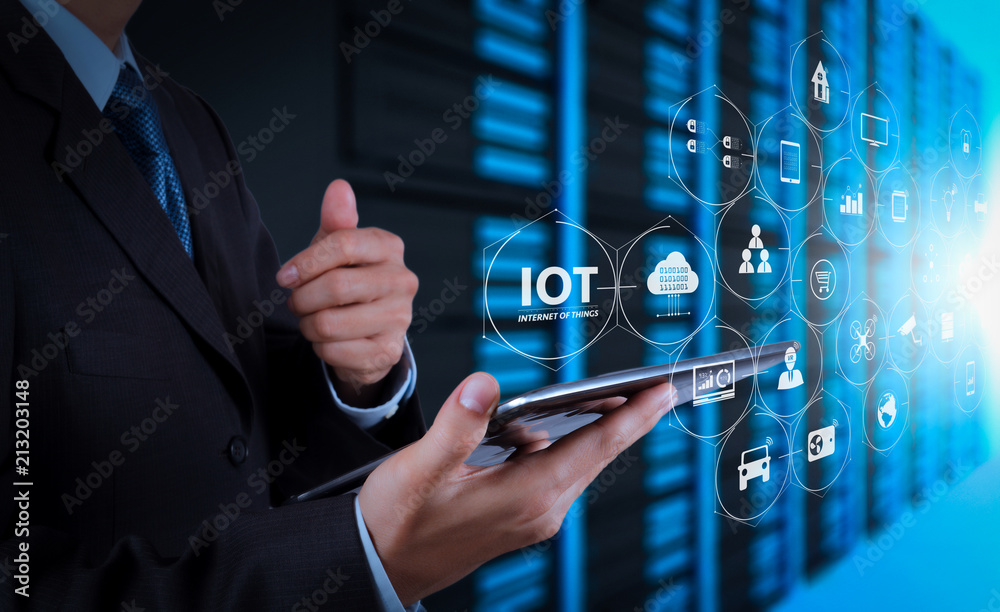 Poster businessman hand using tablet computer and server room