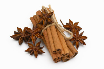 Cinnamon sticks and cardamom on a white background. Aromatic spices.