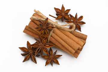 Cinnamon sticks and cardamom on a white background. Aromatic spices.