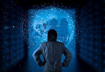 Back View of a Businessman using new computer with VR Connected network over a earth globe concept on a futuristic interface - 3d rendering.