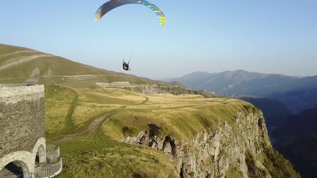 Aerial view. Paragliding in the mountains. Kazbegi, Georgia