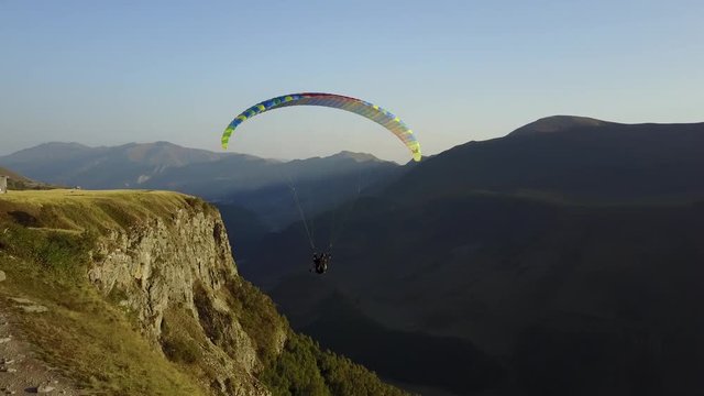 Aerial view. Paragliding in the mountains. Kazbegi, Georgia