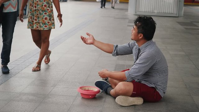 Young man tourist begging after spending so much money