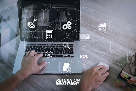 website designer hand attending video conference with laptop computer at desk in office