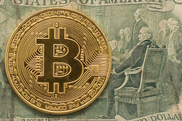 Golden Bitcoin on US dollar bills. Electronic money exchange concept