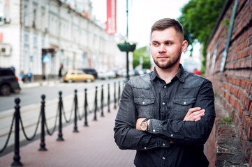 portrait of a Young man in a shirt and trousers