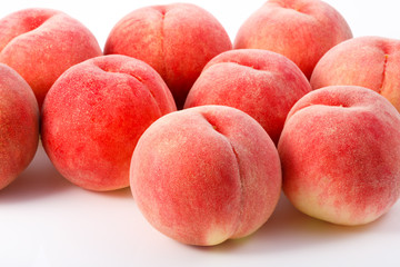 Fototapeta na wymiar Japan Peaches isolated on white background