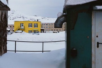 Old dilapidated and partially destroyed houses in which people still live in the village in the far...