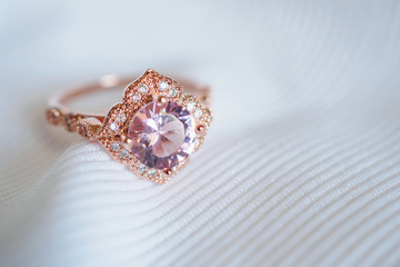 Jewelry luxury pink gold sapphire gemstone ring background