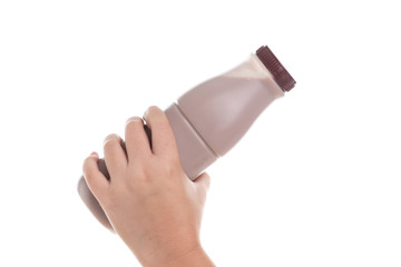 Hand holding Bottle of fresh milk chocolate isolated on white background.