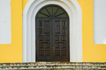 Antique ornate wooden church doorway