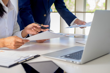 Start up partners are working in casual clothes, discussing the ideas for new strategy of development.