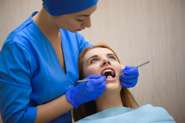Dentist examining a patient's teeth in the dentist.