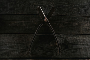  top view of retro scissors on wooden tabletop background