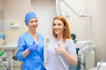 female dentists treating patient