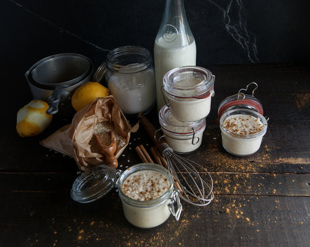 Glass jars with served rice and milk