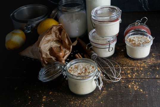 Glass jars with served rice and milk