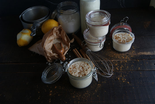 Glass jars with served rice and milk