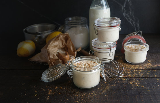 Glass jars with served rice and milk