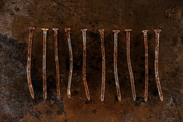 flat lay with vintage nails arranged on sharped rusty surface