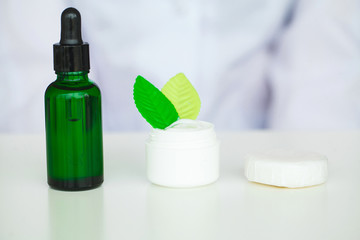 Organic Oil Souring. Woman Working at The Laboratory of Cosmetic Production.Private Small Cosmetic Products Factory. Young Technologist Making Face Care Creams. Private Cosmetic Products Factory