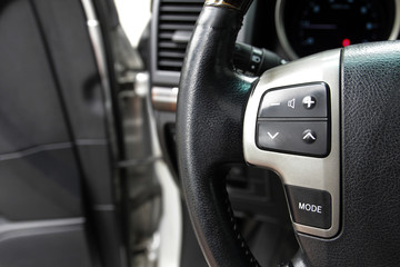 Sound control button on the steering wheel