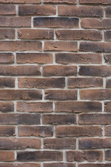 old dirty brown bricks wall pattern texture background vertical shot