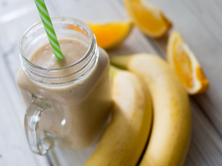 fresh fruit yellow cocktail smoothie from banana and orange