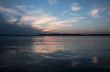 Fototapeta na wymiar sunset at Balaton lake - metallic color, hills in background