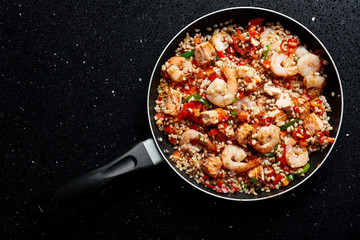 SHRIMP, PEARL BARLEY AND SALOMON ON BLACK GRANITE
