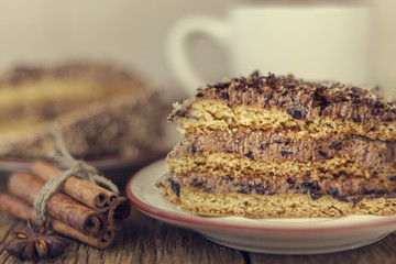 cake with walnuts, prunes and dried apricots on a dark wood background, selective focus