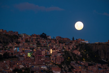 Moon rises over the city of La Paz, Bolivia